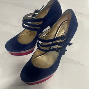 Lightly worn blue and magenta pump.